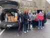 Club members waiting for food donations.
