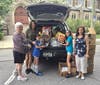 Philanthropy Co-chairs Carolyn Gallaher (l) and  Zsuzsanna Baan-Jonas (r) with Andrea Johnson and her two daughters, who brought donations.
