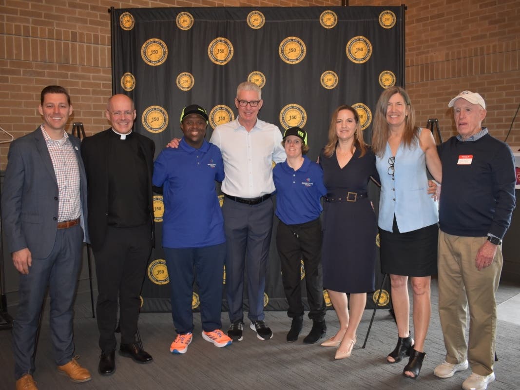 Pictured left to right: Ray Baker, SCC; Fr. Tom Hurley; Adrien Dancy, SCC Ambassador ; Jim Sweeney, IUOE Local 150; Kara McElligott, SCC Ambassador; Amy Taylor, SCC; Fran Hurley, SCC; Jim "Skinny" Sheahan, SCC.