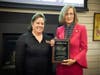 MxCC Foundation Board Chair Laura Krueger ’89 presents the Donor Award to the Liberty Bank Foundation, represented by Susan Murphy, executive director