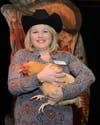 Kristine Quinby and a "chicken bingo" participant at the Western-themed fundraiser for Potential