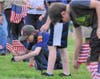 Scouts placing American flags