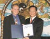 Berkeley City Councilman Kriss Worthington, left, on behalf of Mayor Tom Bates, presents to Dr. Hong a proclamation, by which Mayor Bates declared Aug. 5, 2005 as Federation of World Peace and Love Day in the City of Berkeley.