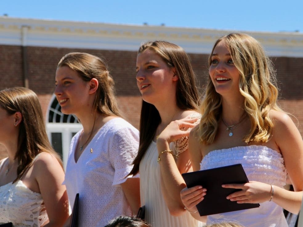 Caroline Smith and Maisie Smith (center) of Simsbury graduated from The Ethel Walker School in June 2019. 