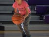 A participant from Walker’s National Girls and Women in Sports Day smiling as she takes a shot.