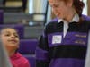 Walker’s basketball player Erin Corbett (Avon) gives instruction for shooting hoops to basketball clinic participant. 