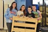 Faith Formation Confirmation students Abby Adamo, Sadie Gearan, Amanda Buckley, Julia Floramo showing off the new headbo