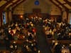 The candlelight spreading through Our Lady of the Assumption Church on Holy Saturday.