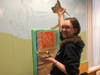 Reading Memorial High School student Megan Coram paints a police K9 as part of a mural inside the newly decorated public