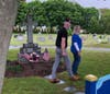 Susan A. Lowe and her son, James Norrie, place a wreath at St. Mary's Cemetery, to remember a loved one.