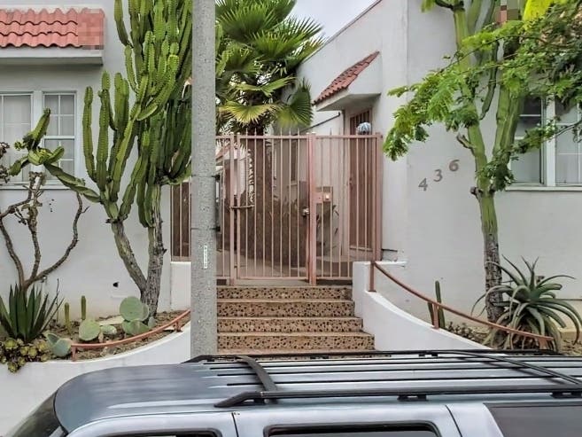 Police say the driver backed over and killed a toddler and injured two other people in front of this Long Beach apartment complex.