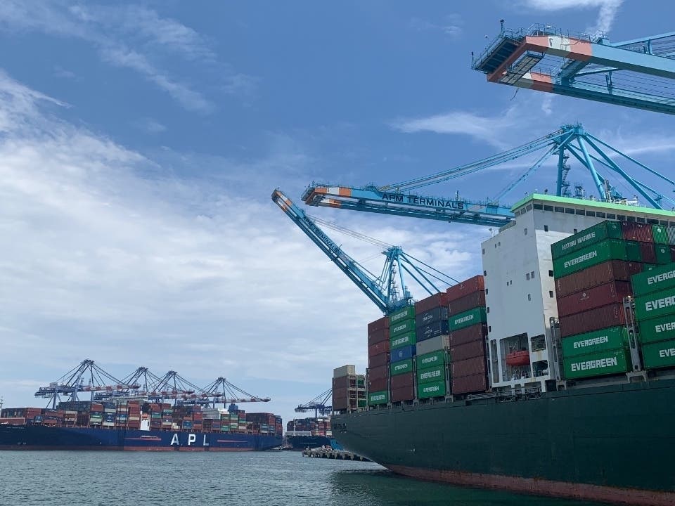 A storm-battered cargo ship, similar to the ones pictured here, has berthed at the Port of Long Beach with cargo stacks teetering on the edge of collapse.