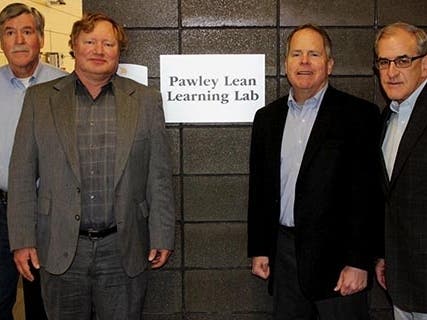 Robert Van Til, Bill Edwards, Bill Artzberger, and Dennis Wade outside the Pawley Lean Learning Lab at Oakland University.