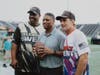 Donovan McNabb (left), Warrick Dunn (center), Doug Flutie): honorary captain Dunn and team captains Flutie and McNabb prior to kickoff of the 20th annual Celebrity Flag Football Challenge presented by SunTrust now Truist.