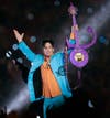 In this Feb. 4, 2007 file photo, Prince performs during halftime of the Super Bowl XLI football game in Miami.