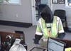 The Renton bank robbery suspect was disguised in a black hoodie, but was wearing a flashy safety vest. 