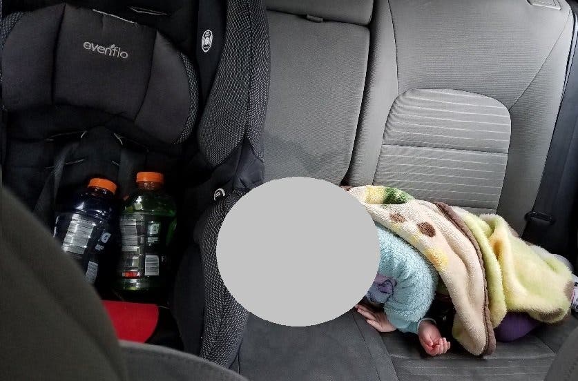 Redmond police captured this image of a baby sleeping in the backseat of a car pulled over for speeding. 