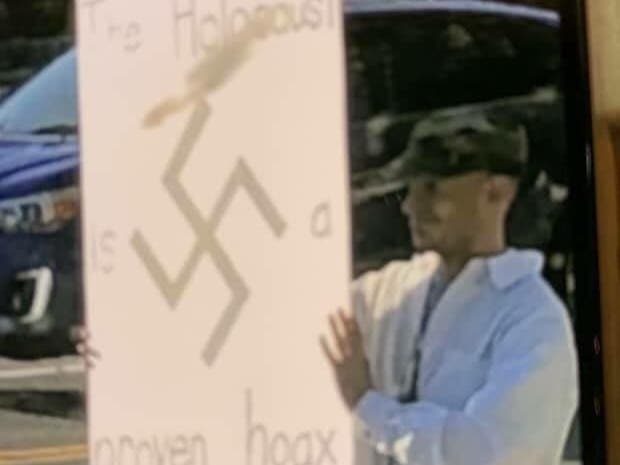 The man who appeared with a Holocaust-denying sign near Northeast 175th Street and 140th Avenue Northeast in Woodinville.