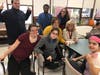 Students with Erin Miller, the Director of Student Services, Paraprofessional Nancy Dunlap and Dominque Fortini. 