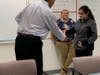 Jordan Robie giving an award to Greg Tutuny Director of Natick Service Council 