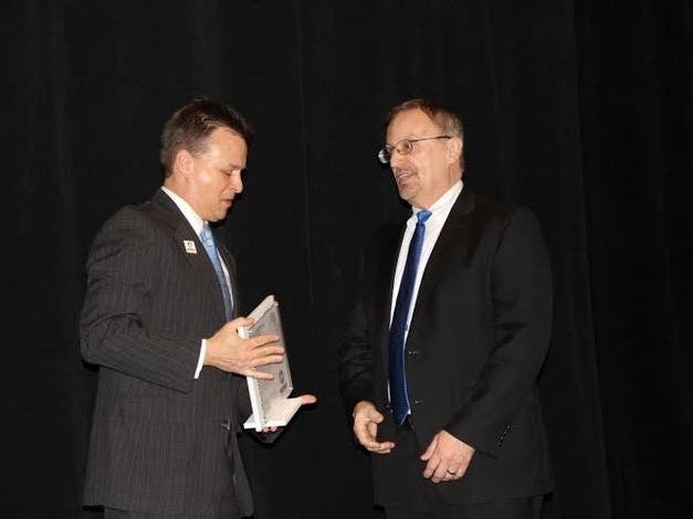 Framingham Public Works Director Peter Sellers (r) receiving the Elizabeth A. Cutone Executive Leadership Award in 2016. 