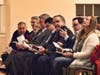Members of the Framingham City Council watch a video that played before Spicer's speech. 