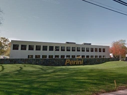 Framingham is negotiating to buy the Perini building along Mt. Wayte Avenue for about $13 million to house city offices. 