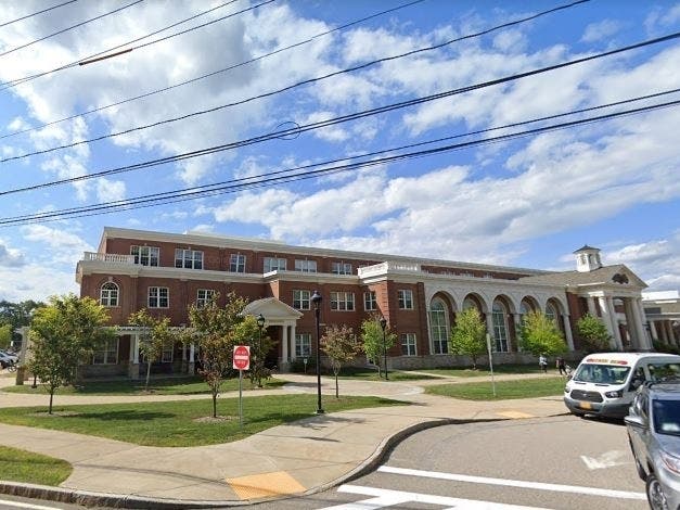 Two Natick High School students tested presumptive positive for the new coronavirus this week. 