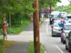 A family waves to a parade headed south down Oak Street. 