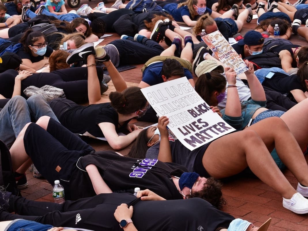A rally at Memorial Hall in Framingham, where a crowd of people got down on the ground — the same position George Floyd was in when he was killed.
