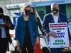 U.S. Sen. Elizabeth Warren and U.S. Rep. Jim McGovern walk toward the strike line outside St. Vincent Hospital on Friday. 