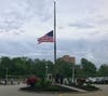 Worcester police officers lowered a flag to half-mast Friday evening outside police headquarters in memory of officer Enmanuel Familia who died in a drowning at Green Hill Park. 