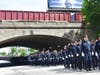 Worcester police officers line Grafton Street in Worcester, marching ahead of Officer Manny Familia's casket. 