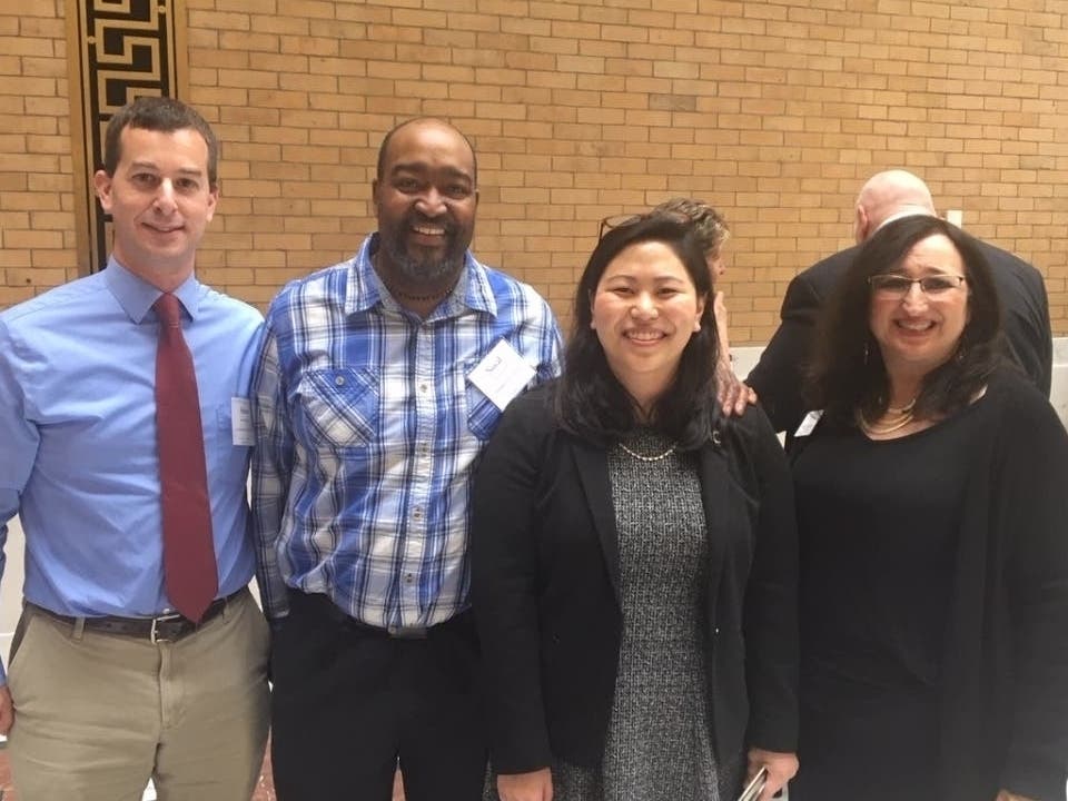 State Rep. Maria Robinson (second from right) with Framingham School Committee Chair Adam Freudberg (l), Noval Alexander and School Committee member Beverly Hugo (r) in 2019. 