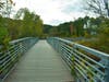 After passing through the arch, a boardwalk takes pedestrians and bikers through a stretch of the Middle River and surrounding wetlands. 