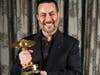 Paul Salamoff is shown with his recent Saturn Award for best independent film for "Encounter."
