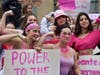 A group of Clark University students flex at an abortion access demonstration outside the Worcester County Superior Court building on Tuesday. 