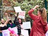 Clark University students lead a chant at the abortion access rally on Tuesday. 