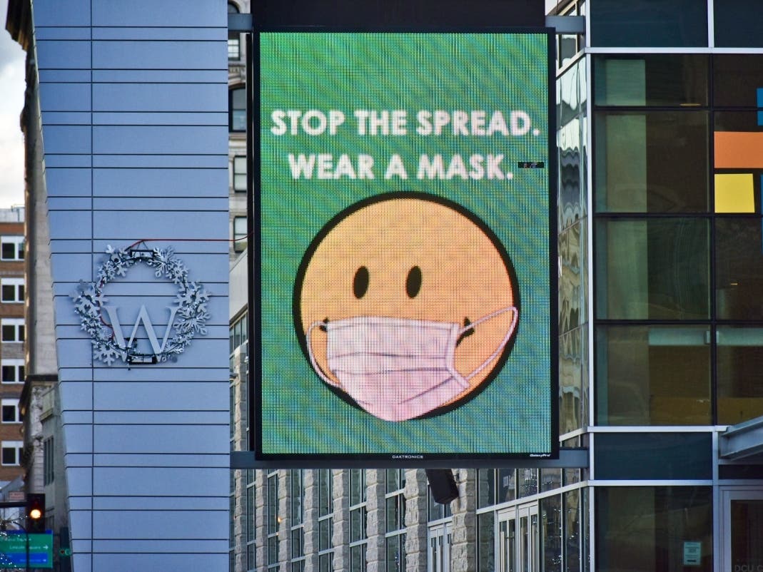 An electronic billboard outside the DCU Center in Worcester urging residents to wear masks. 