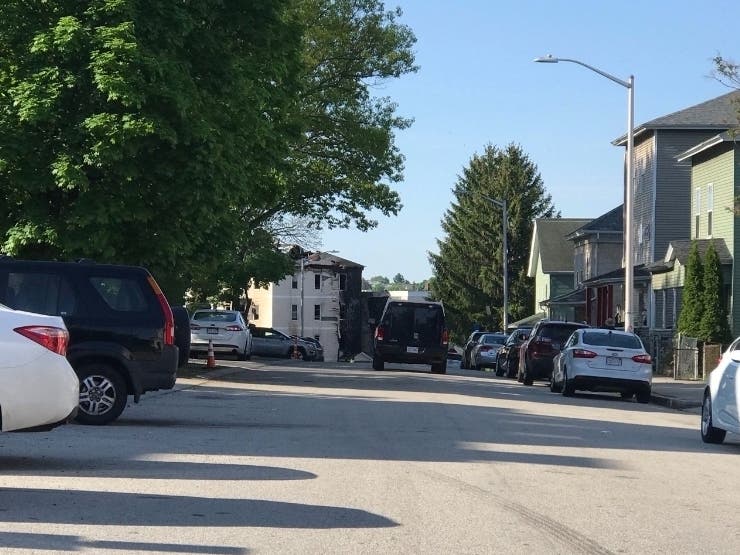 On Monday, streets near a Gage Street triple-decker where four residents died in a fire was blocked off to traffic. 