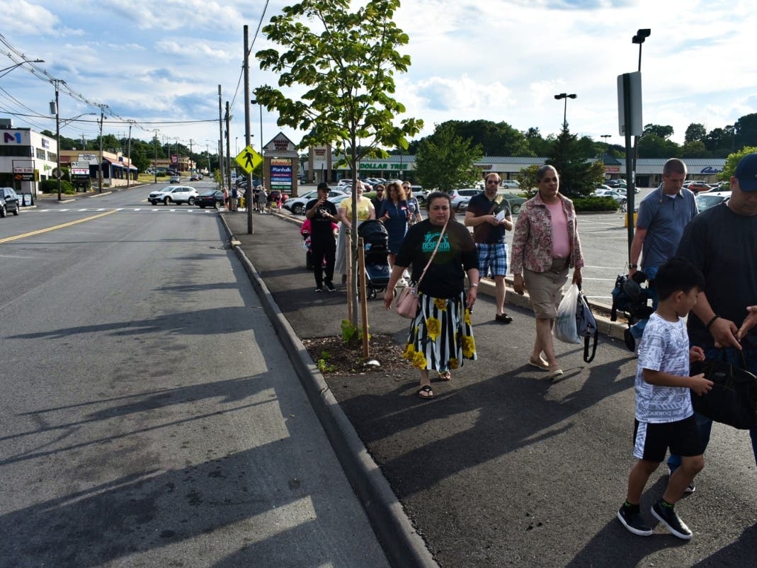 More than a dozen residents, business owners and elected officials walked a half-mile stretch of Stafford Street on Wednesday near where a driver hit Candice Asare-Yeboah in April.