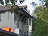 Worcester firefighters douse the triple-decker with water as smoke and steam pour out from the top floor. 