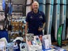 A member of Woods Hole Flotilla staffing a safe boating display with educational materials for boaters during National Safe Boating Week