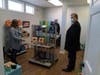 Compass Mortgage president & COO Kevin Williamson (rear) and senior loan office Jeff Kincaid admire some of the DoodleBug Workshop seasonal products. 