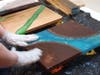 Wood and resin are combined in different combinations to make beautiful upscale products.