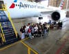 ACE Academy students and mentors - including four students from Southern Illinois - visit an American Airlines aircraft hangar as part of the Lewis U. aviation-career exploration activities. The four young men are students in Mentoring Mission's AMPLIFI.