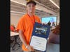 Levi Knapp displays his certificate after completing the 2026 Lewis University Aviation Career Education Academy
