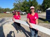 Melissa Mitchum, FINFROCK Corporate Communications Manager and Shanda Lee, FINFROCK Executive Vice President of Marketing, do the heavy lifting
