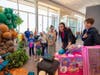 Sara Bishop, General Manager at AutoNation Subaru Scottsdale, surprises Wish Kid Elsa and her family with gifts