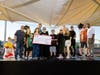 AutoNation Associates gather with representatives from Phoenix Children’s Foundation to celebrate a $100,000 donation that will help send 100 children to Camp Rainbow.